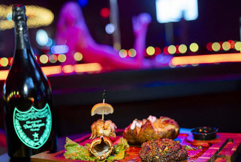 Steakhouse dining and champagne at Rick's Central City